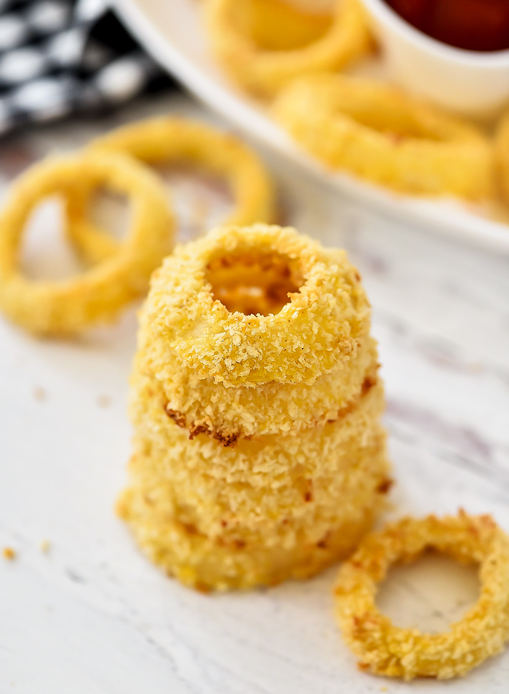 Delicious and crispy homemade Onion Rings that are baked in the oven. Life-in-the-Lofthouse
