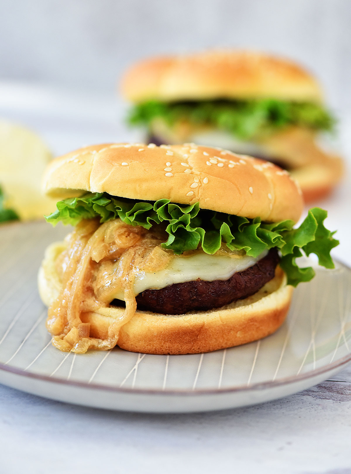 French Onion Burgers are loaded with provolone cheese and saut&eacute;ed onions. Life-in-the-Lofthouse.com