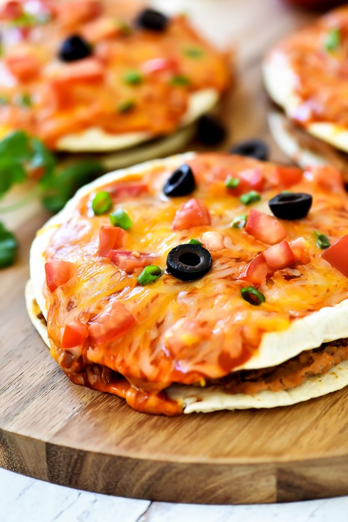 Mexican Pizza is filled with seasoned ground beef, beans, cheese and enchilada sauce stuffed between two golden flour tortillas. Life-in-the-Lofthouse.com