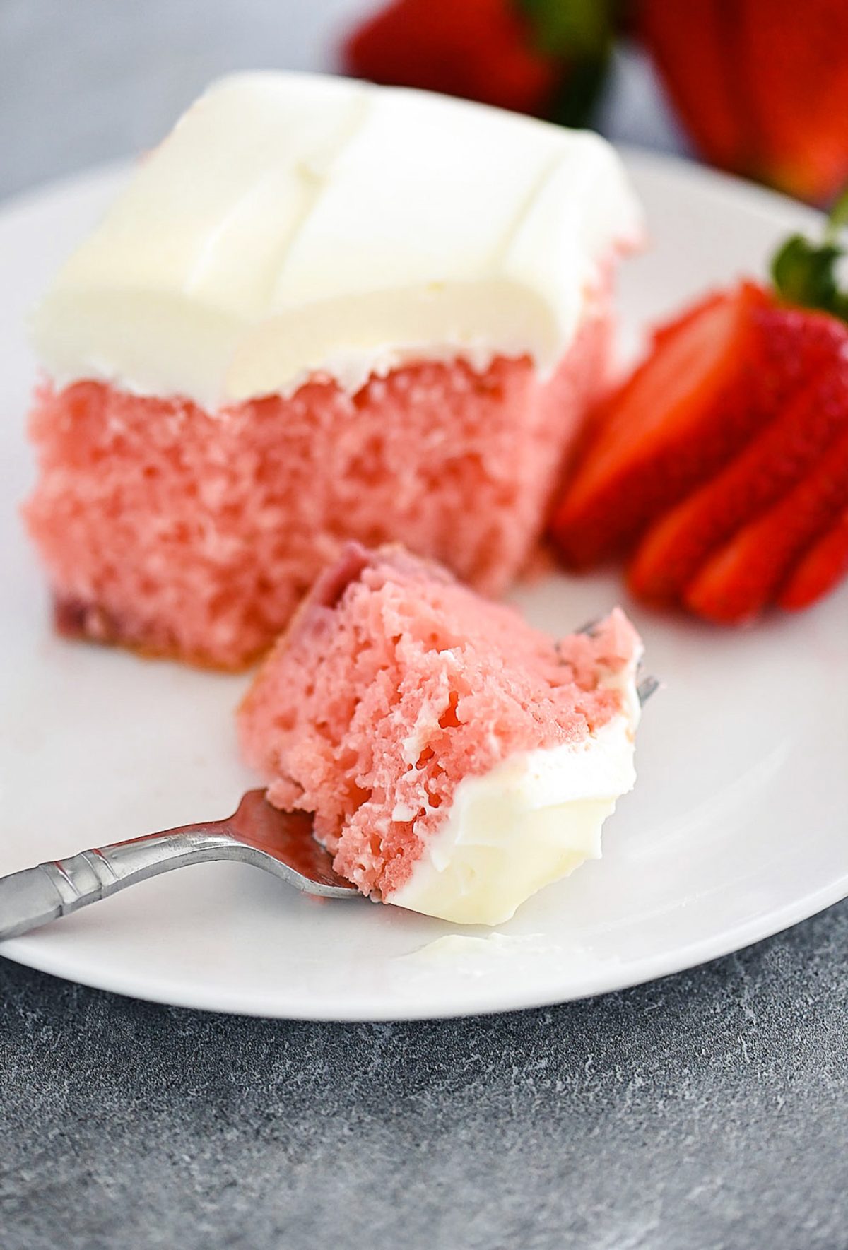 A sweet strawberry cake filled with fresh strawberries and topped with cream cheese frosting. Life-in-the-Lofthouse.com