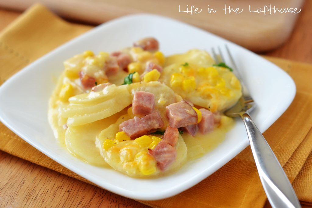 Delicious cheesy and buttery scalloped potatoes covered in ham and corn. Life-in-the-Lofthouse.com