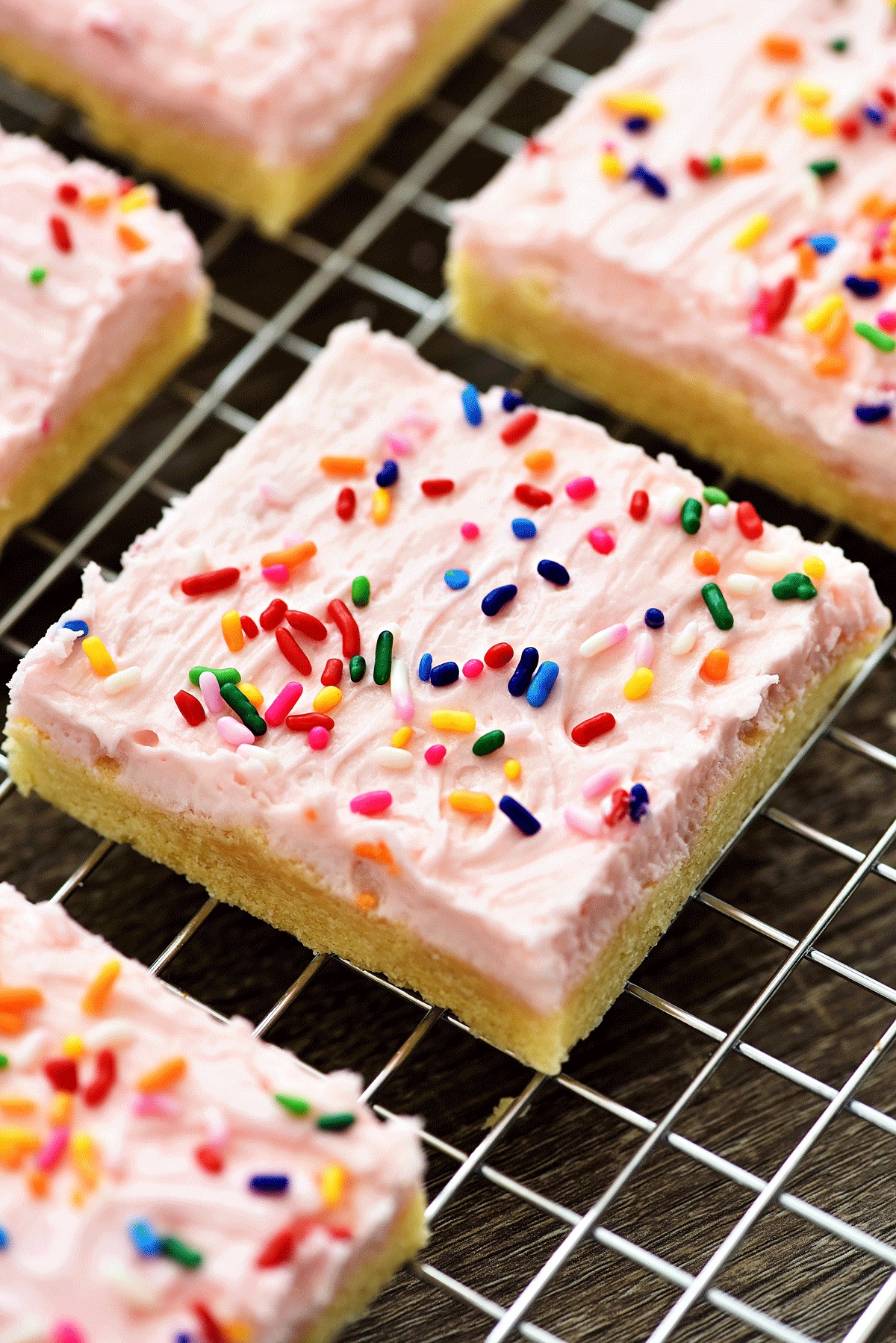 Soft, frosted and perfectly delicious Sugar Cookie Bars! These amazing cookie bars would be perfect for any occasion. You can change the color according to the holiday.