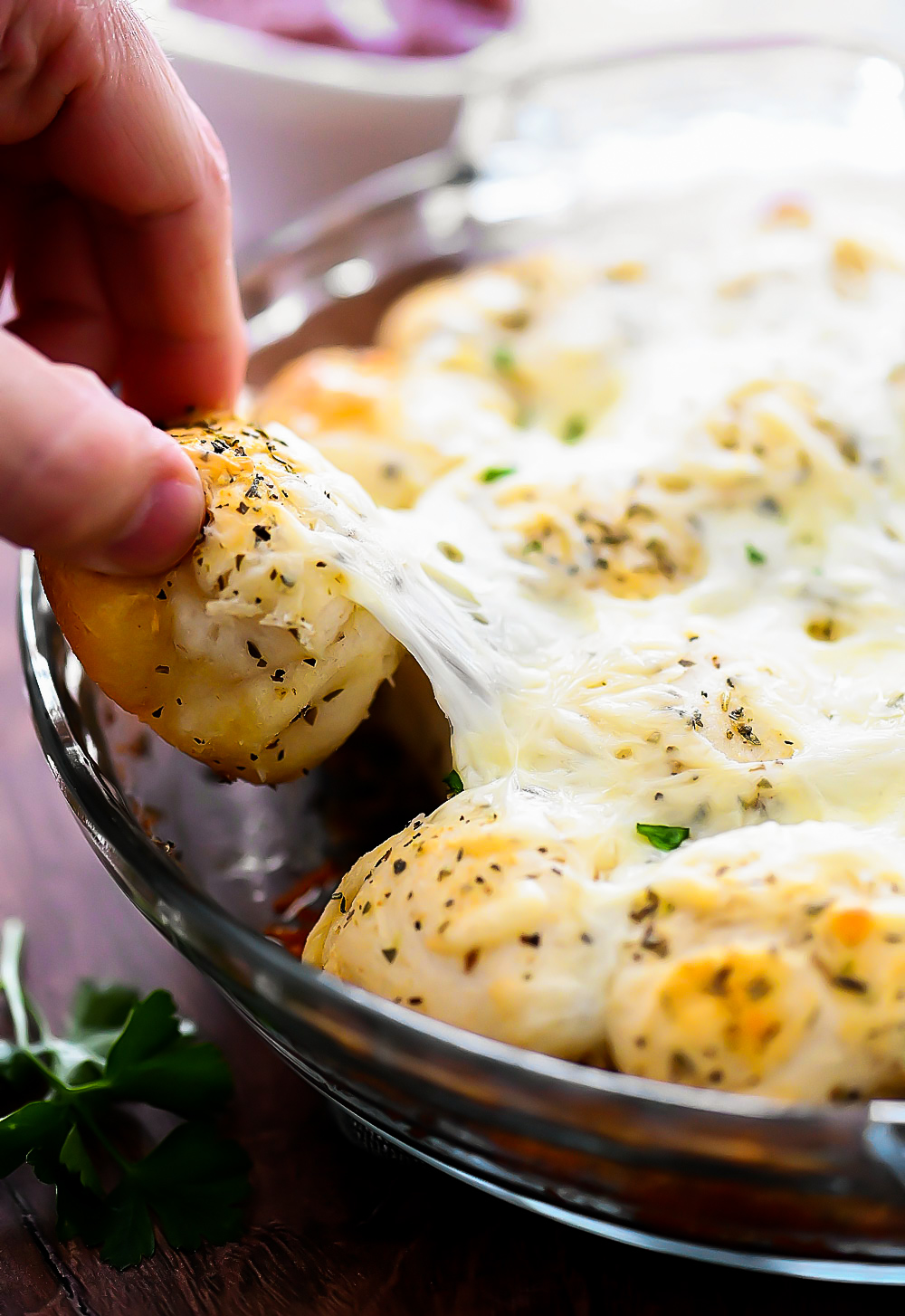 Cheesy Garlic Pull Apart Rolls are buttermilk biscuits covered in melted Mozzarella cheese, herbs and garlic butter.