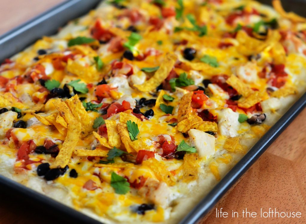 Southwest Chicken Pizza starts with ranch dressing and is topped with seasoned chicken, black beans, salsa and lots of cheese. Life-in-the-Lofthouse.com