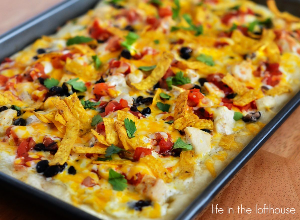 Southwest Chicken Pizza starts with ranch dressing and is topped with seasoned chicken, black beans, salsa and lots of cheese. Life-in-the-Lofthouse.com