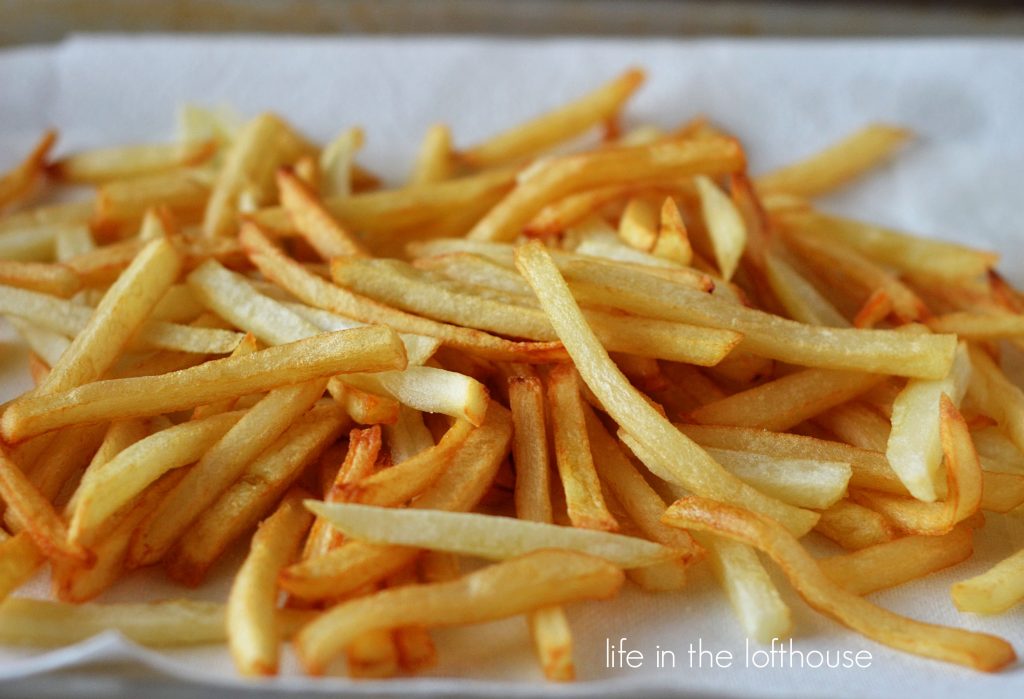 Garlic Parmesan french fries are perfect double-fried french fries coated with Parmesan cheese, garlic and parsley. Life-in-the-Lofthouse.com