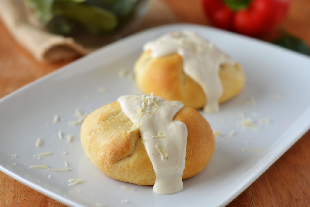 Creamy chicken-garlic bundles are shredded chicken, bell pepper, garlic, spinach, Parmesan cheese and Alfredo sauce all wrapped inside crescent rolls. Life-in-the-Lofthouse.com