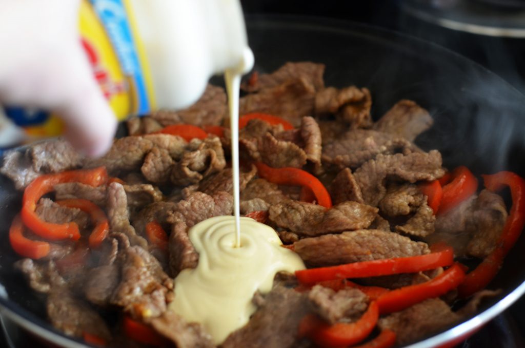 Think steak, cheese and bell peppers tossed in creamy Rag&ugrave;&reg; Cheese Creations Classic Alfredo Sauce baked on French bread make up this Italian cheese steak french bread pizza. Life-in-the-Lofthouse.com