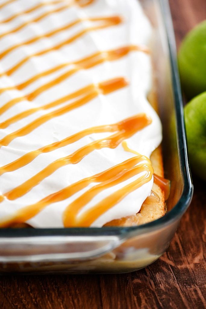 Caramel apple poke cake is a light and moist cake that tastes like caramel apples. Life-in-the-Lofthouse.com