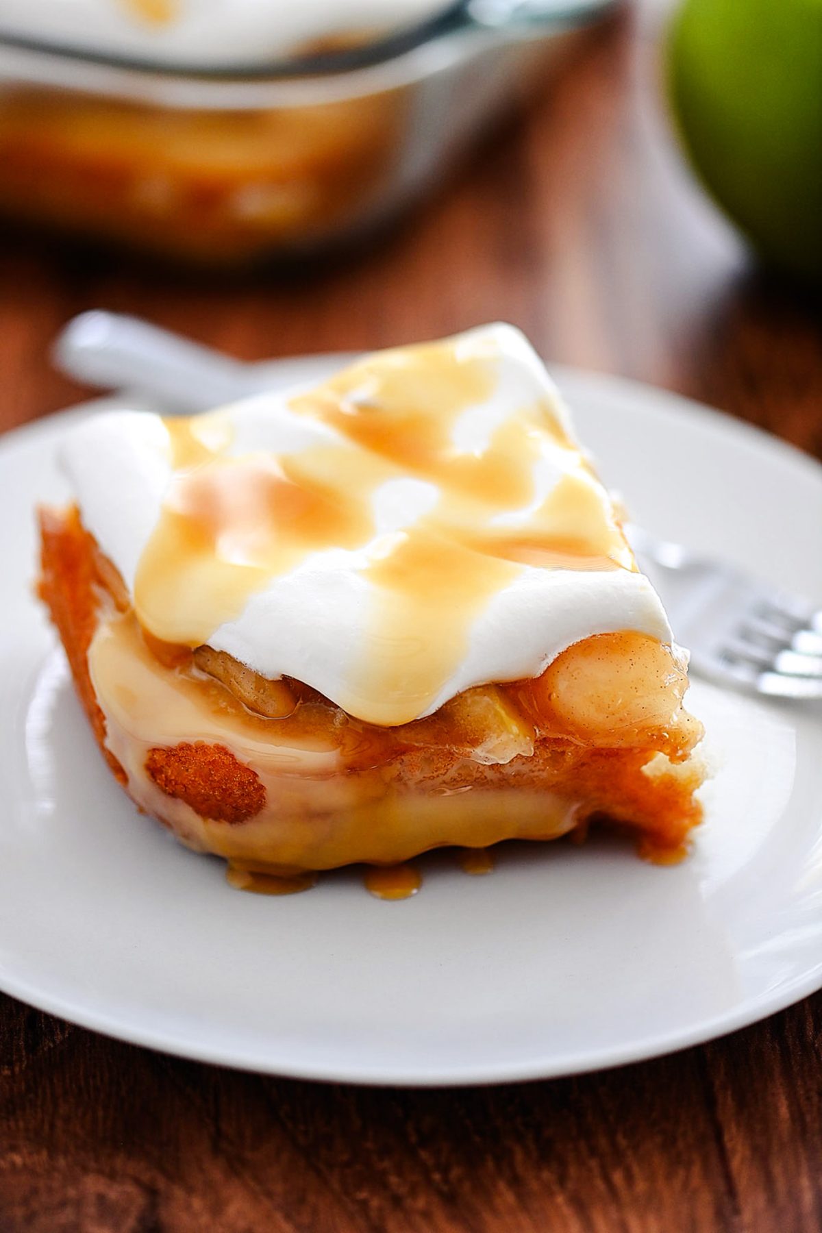 Caramel apple poke cake is a light and moist cake that tastes like caramel apples. Life-in-the-Lofthouse.com