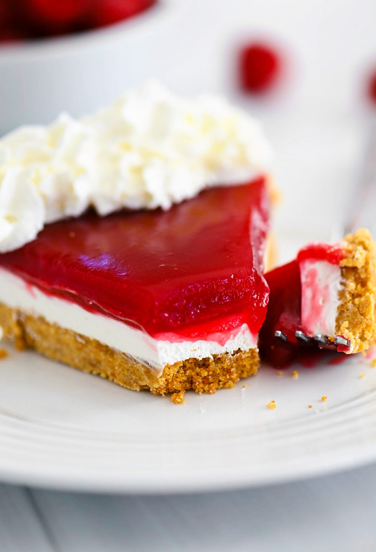 Raspberry Cream Pie has a graham cracker crust, cream cheese filling and raspberry topping!