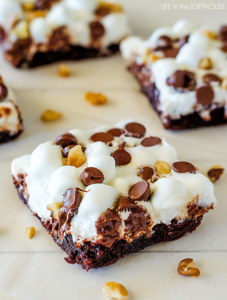 Rocky road brownies are soft and delicious brownies covered in mini marshmallows, chocolate chips and chopped walnuts. Life-in-the-Lofthouse.com