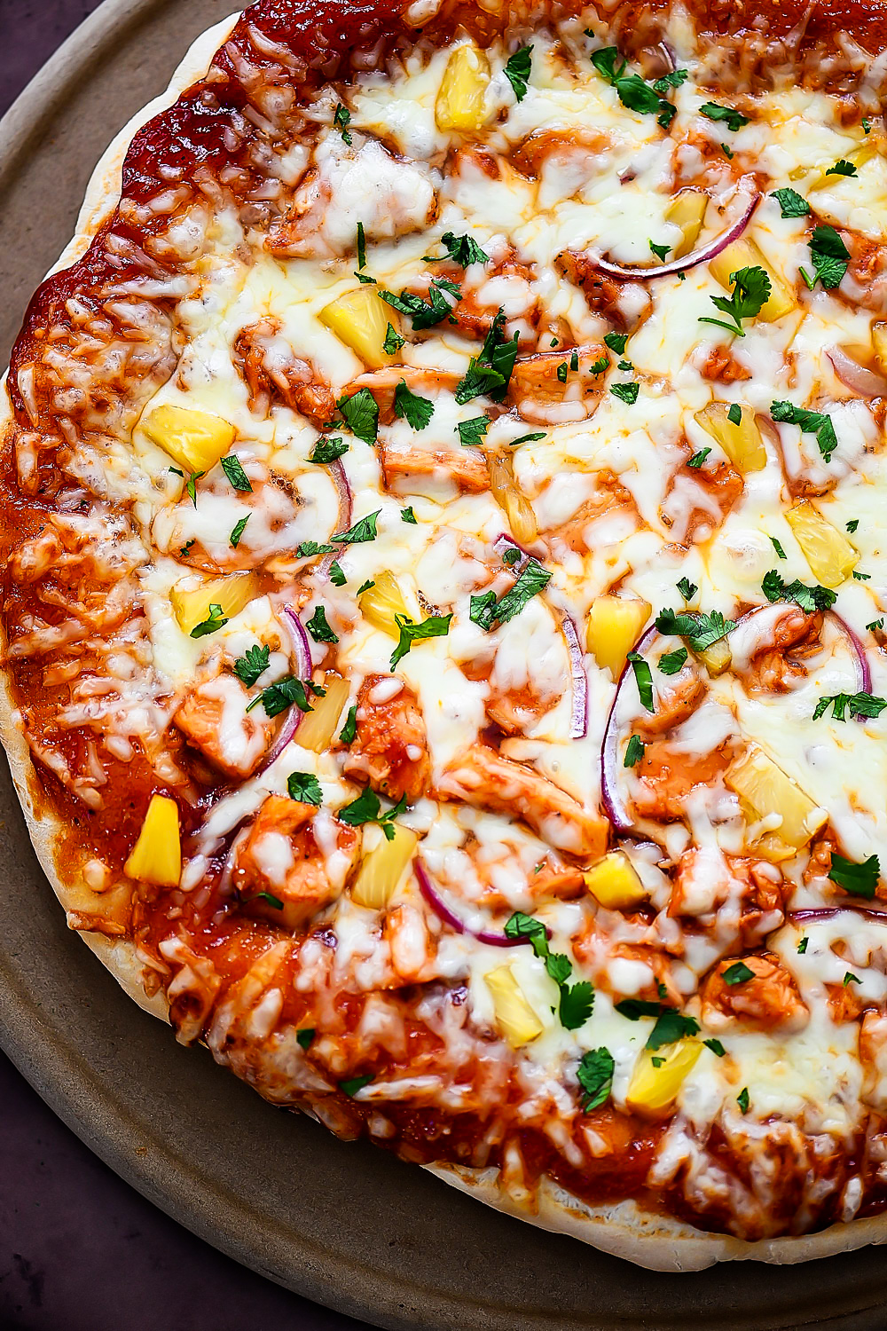 This Hawaiian BBQ Chicken Pizza is loaded with cheese, barbecue sauce, pineapple, red onion and cilantro. Life-in-the-Lofthouse.com