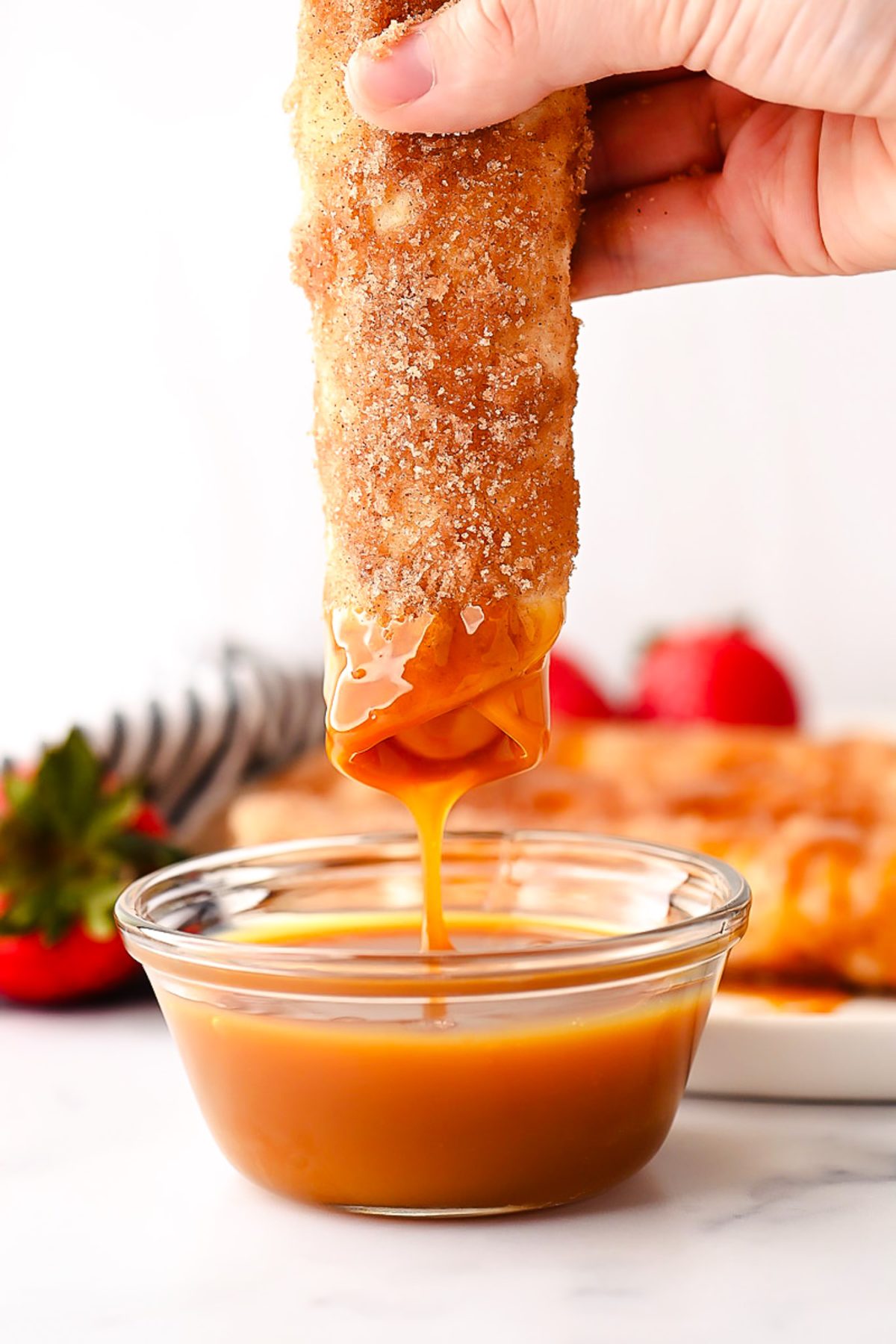 Cheesecake Taquitos have a silky-smooth cheesecake filling wrapped inside a crispy flour tortilla that's been rolled in cinnamon and sugar. Life-in-the-Lofthouse.com