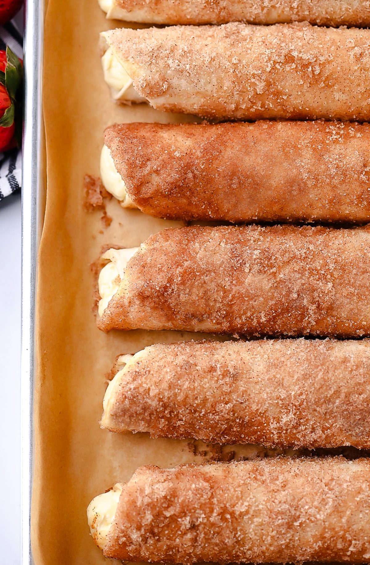 Cheesecake Taquitos have a silky-smooth cheesecake filling wrapped inside a crispy flour tortilla that's been rolled in cinnamon and sugar. Life-in-the-Lofthouse.com