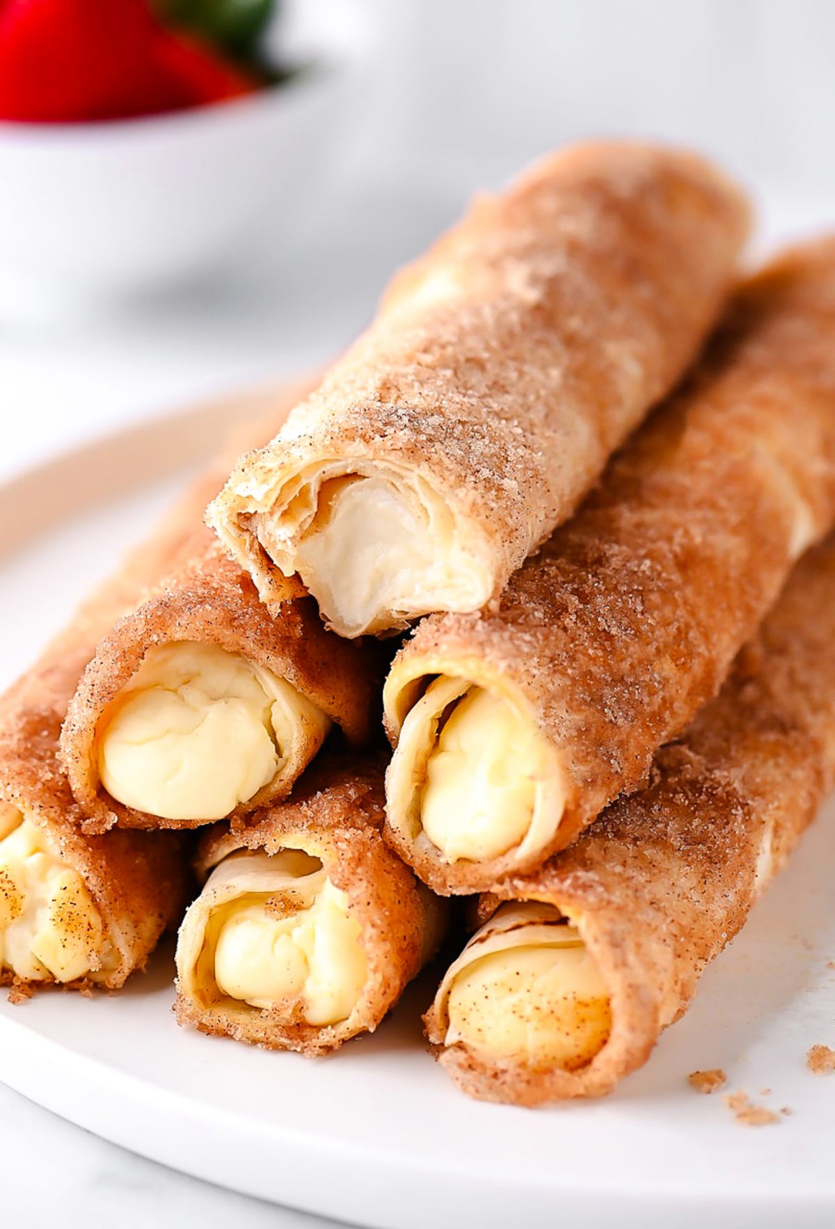 Cheesecake Taquitos have a silky-smooth cheesecake filling wrapped inside a crispy flour tortilla that's been rolled in cinnamon and sugar. Life-in-the-Lofthouse.com