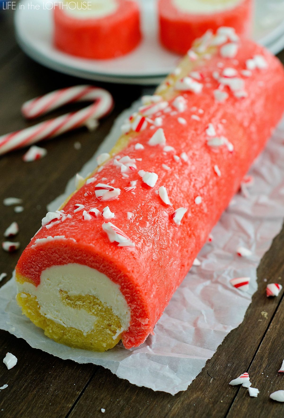 Candy cane cake roll has swirls of red and white cake that's filled with peppermint buttercream. Life-in-the-Lofthouse.com