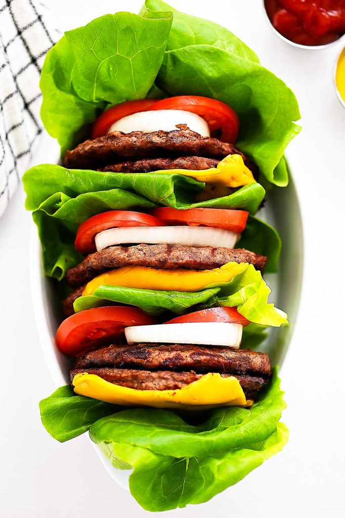 A flavorful burger topped with cheese, tomato, and a mouth-watering spread wrapped in lettuce. Life-in-the-Lofthouse.com