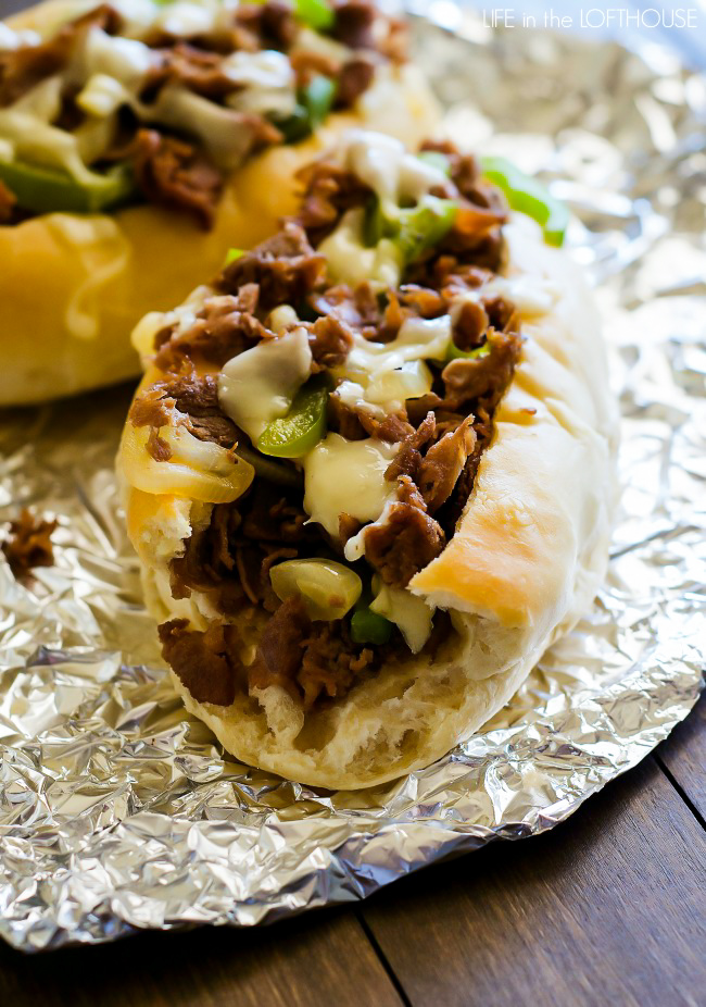 Cheesesteak sandwiches are hearty, flavorful sandwiches full of sliced steak, green pepper, onion and Provolone cheese. Life-in-the-Lofthouse.com