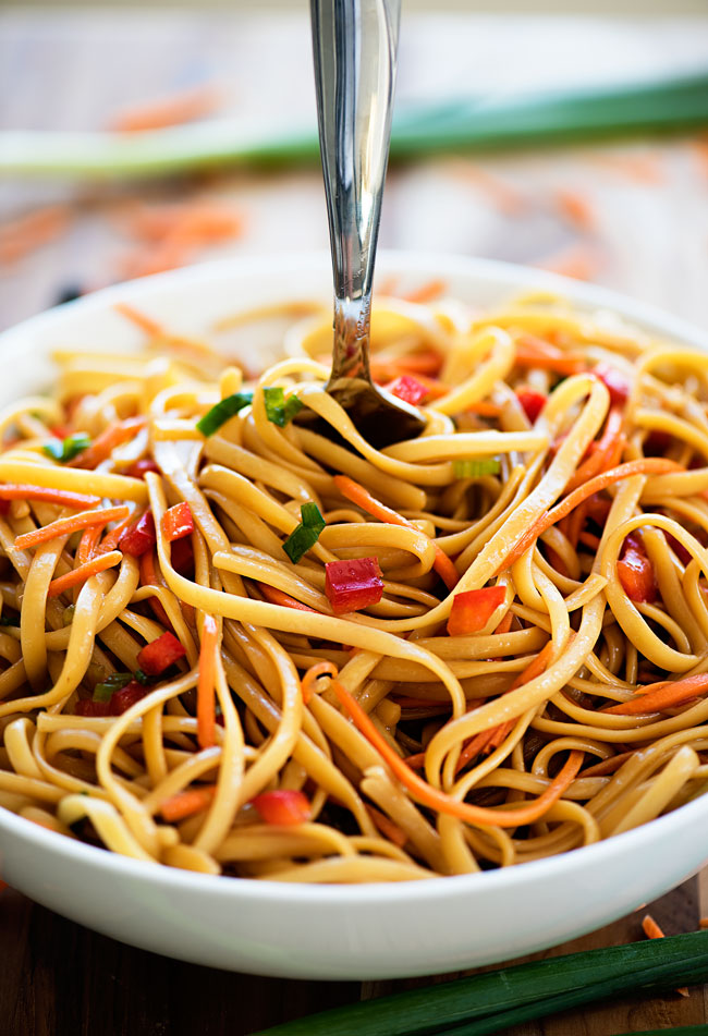 Asian pasta salad is a delicious salad made with noodles, fresh veggies and a soy sauce and brown sugar mixture. Life-in-the-Lofthouse.com