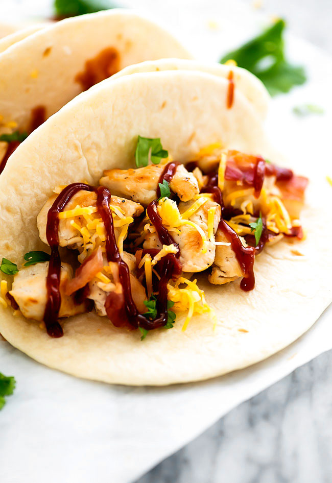 BBQ Chicken Bacon Tacos are filled with grilled chicken, bacon, cheese and barbecue sauce all inside a flour tortilla. Life-in-the-Lofthouse.com