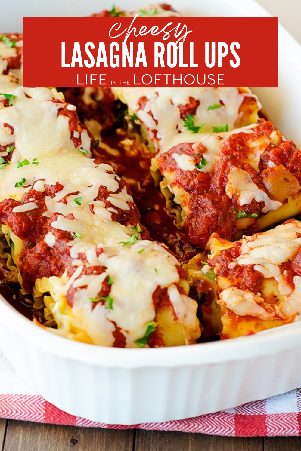 Cheesy Lasagna Roll Ups in a white deep dish