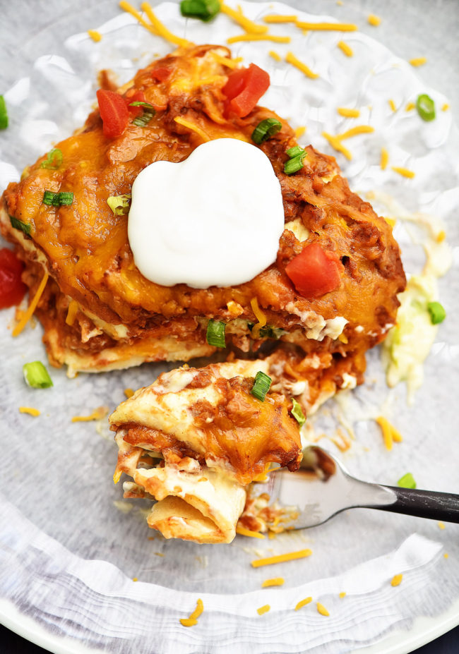 Baked burrito casserole has layers of flour tortillas, beans, meat and cheese. Life-in-the-Lofthouse.com