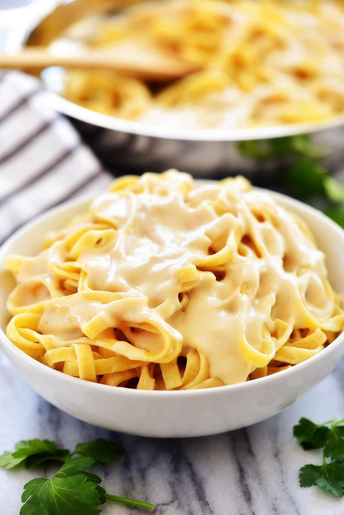 This fettuccine Alfredo is a creamy Italian pasta that uses lighter ingredients. Life-in-the-Lofthouse.com