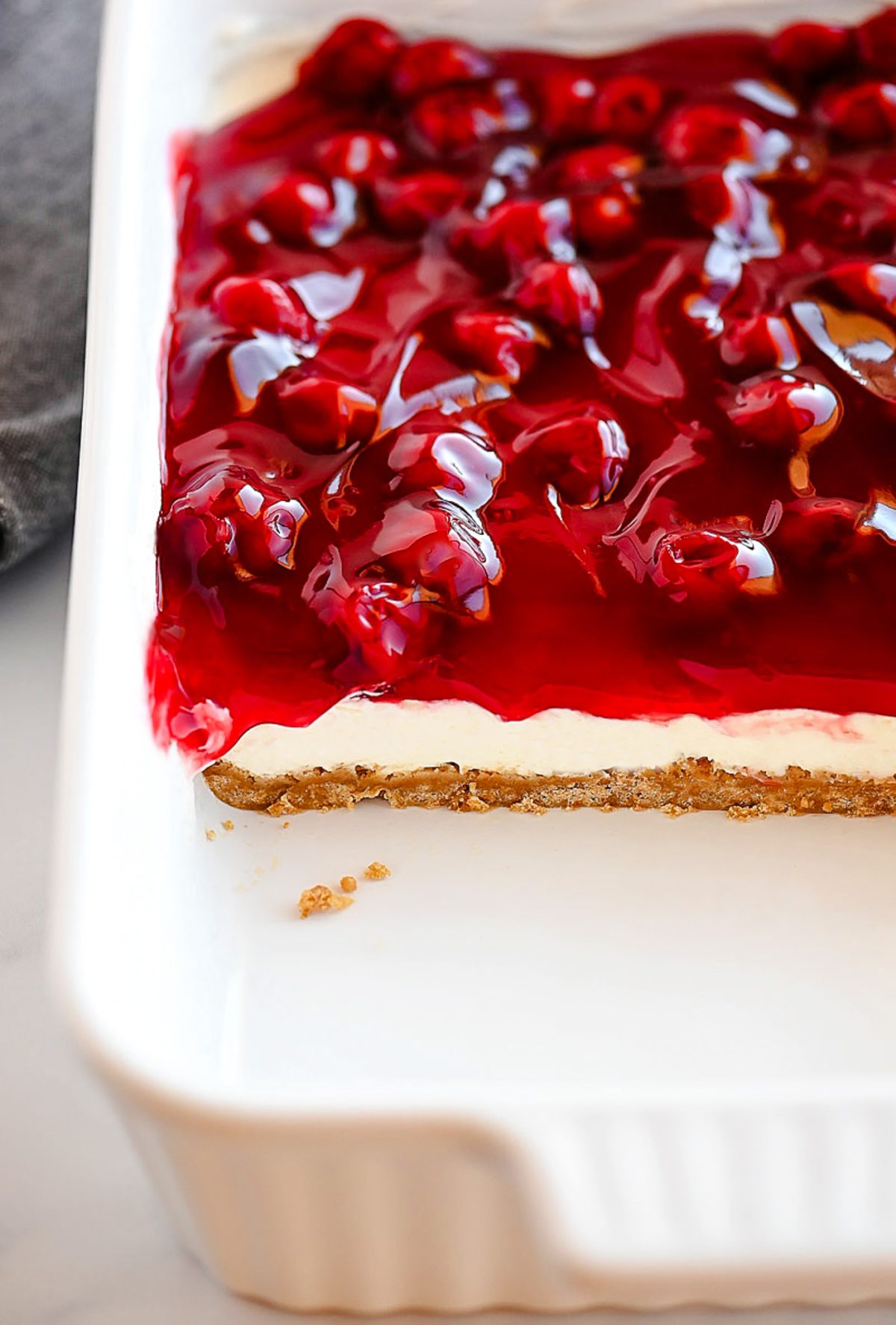 Cherry Delight is an easy dessert recipe with a graham cracker crust, a cheesecake center and topped off with delicious cherry pie filling!
