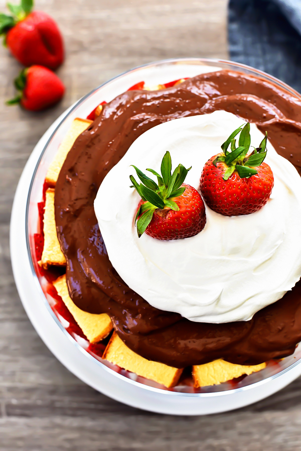 Strawberry Chocolate pound cake trifle has layers of pound cake, chocolate, whipped cream and loads of strawberries. Life-in-the-Lofthouse.com