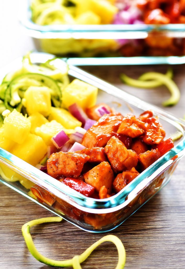Hawaiian Chicken meal prep bowls are filled with seasoned barbecue chicken, bell pepper, fresh pineapple, red onion and zucchini noodles. Life-in-the-Lofthouse.com