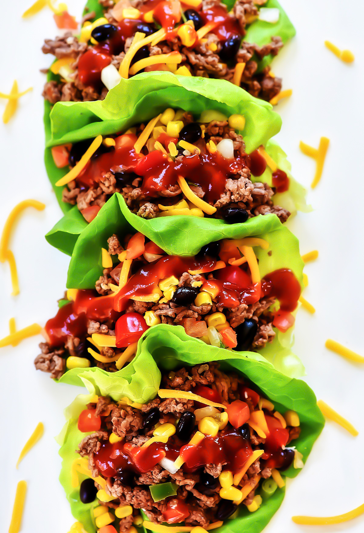 Taco Lettuce Wraps are filled with seasoned ground beef, corn, black beans, cheese and taco sauce. Life-in-the-Lofthouse.com