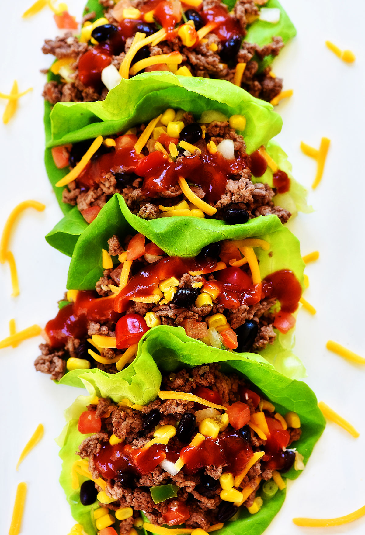 Taco Lettuce Wraps are filled with seasoned ground beef, corn, black beans, cheese and taco sauce. Life-in-the-Lofthouse.com