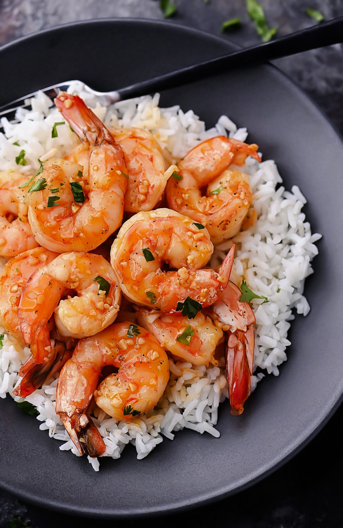 Hawaiian-style garlic shrimp: juicy, seasoned shrimp sizzling to perfection, inspired by the North Shore, offering a flavorful taste of the islands.
