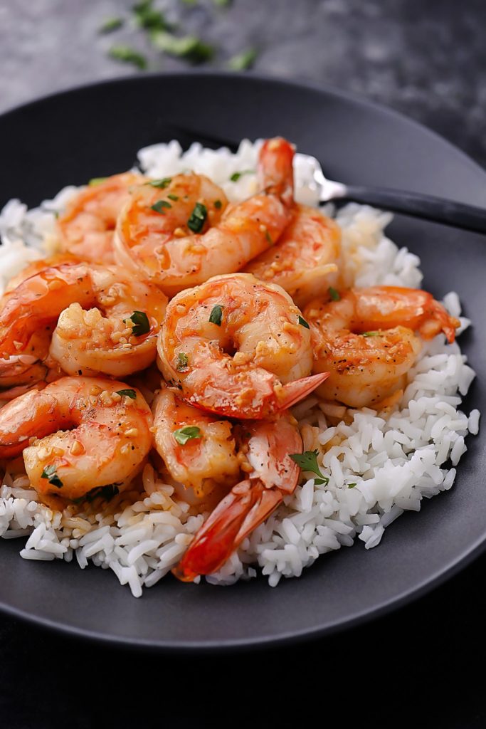 Hawaiian-style garlic shrimp: juicy, seasoned shrimp sizzling to perfection, inspired by the North Shore, offering a flavorful taste of the islands.