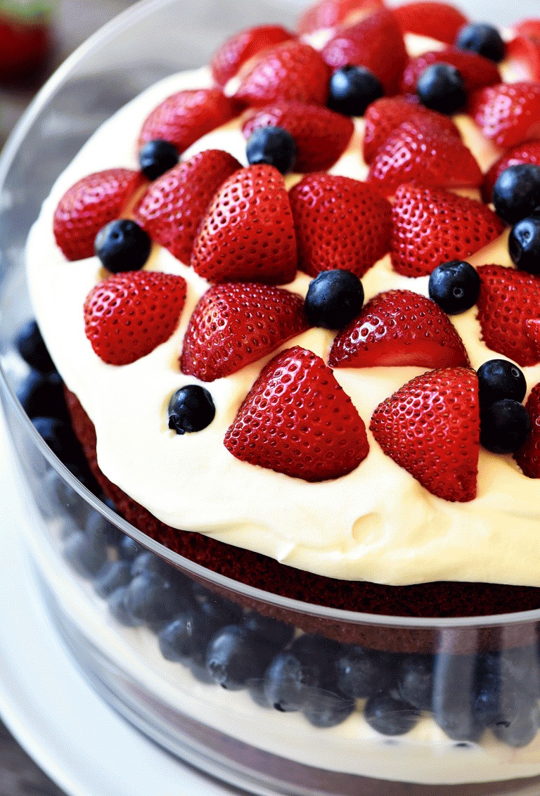 This delicious Red Velvet Trifle has layers of red velvet cake, cream cheese, strawberries and blueberries. Life-in-the-Lofthouse.com