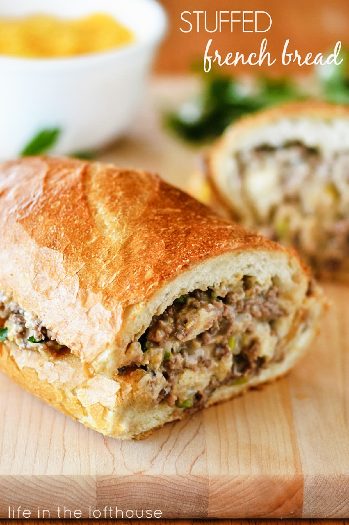 Stuffed french bread is full of a cheesy and flavorful ground beef mixture stuffed inside French Bread. Life-in-the-Lofthouse.com
