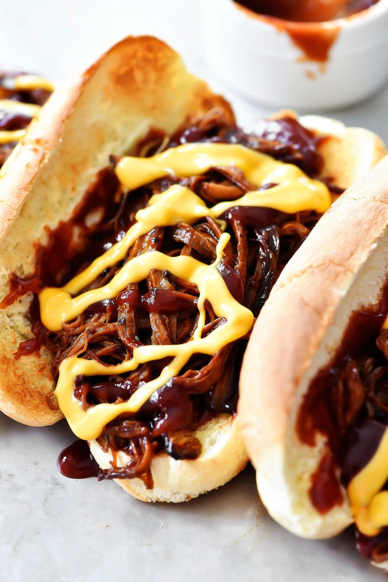 BBQ beef brisket sandwiches have tender BBQ Brisket loaded in a hoagie bun with drizzles of cheddar cheese. Life-in-the-Lofthouse.com