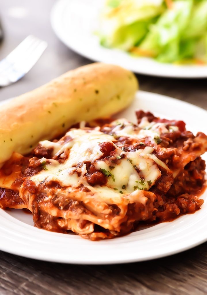 This Cream Cheese Lasagna is made with an easy homemade tomato sauce and loaded with cheese. Life-in-the-Lofthouse.com