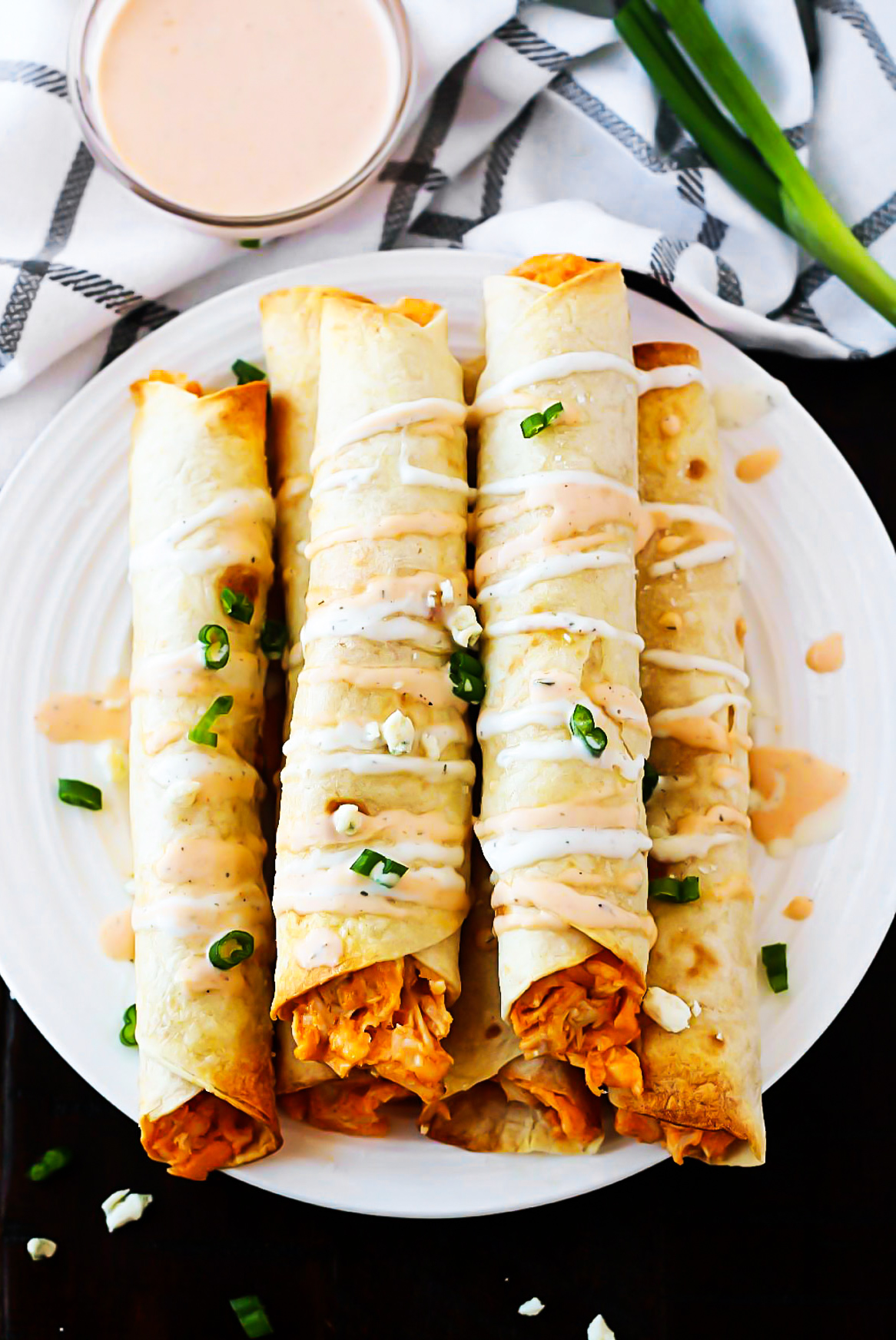 These Baked Buffalo Chicken Taquitos are filled with shredded chicken, cream cheese, ranch dressing, wing sauce and sharp cheese. Life-in-the-Lofthouse.com
