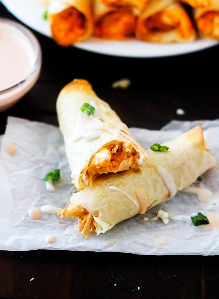These Baked Buffalo Chicken Taquitos are filled with shredded chicken, cream cheese, ranch dressing, wing sauce and sharp cheese. Life-in-the-Lofthouse.com