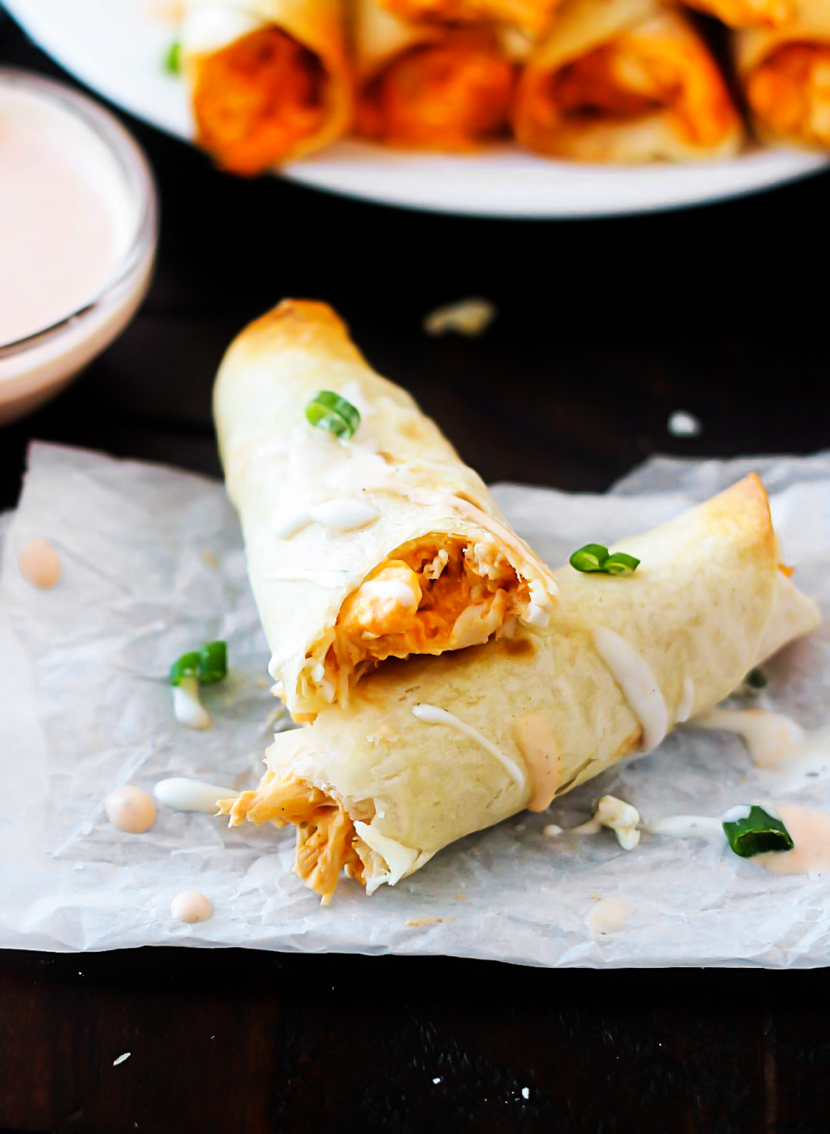 These Baked Buffalo Chicken Taquitos are filled with shredded chicken, cream cheese, ranch dressing, wing sauce and sharp cheese. Life-in-the-Lofthouse.com