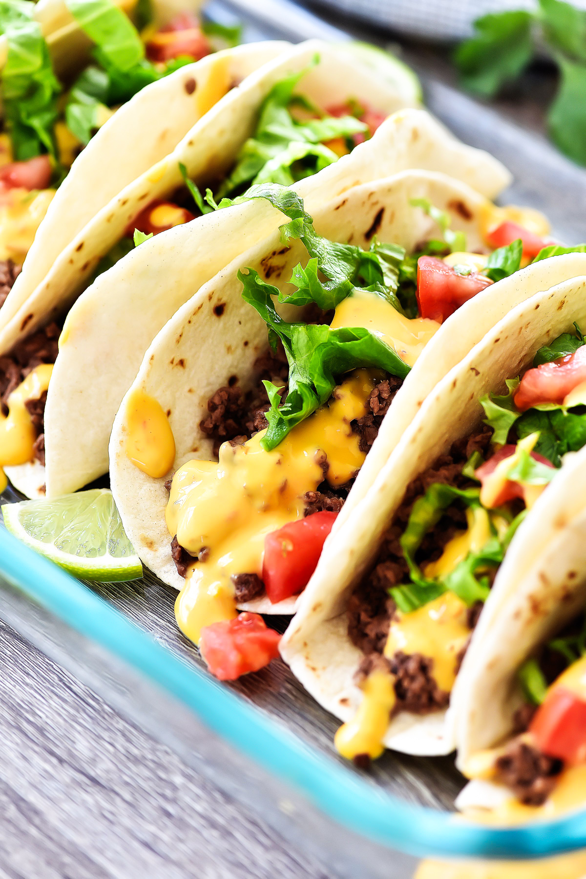 These soft tacos are filled with seasoned ground beef and are all warmed up in the oven. Life-in-the-Lofthouse.com