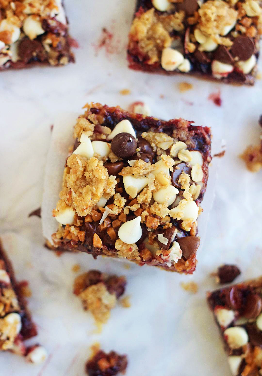 Blackberry Bliss Bars have a brown sugar cookie base with coconut and oats and are topped with a layer of blackberry jam, three kinds of chocolate chips and toffee pieces. Life-in-the-Lofthouse.com