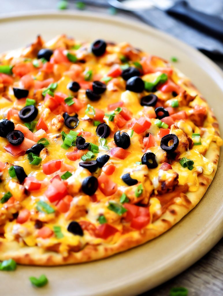 Chicken Taco Pizza is loaded with seasoned chicken, refried beans and cheese. Life-in-the-Lofthouse.com