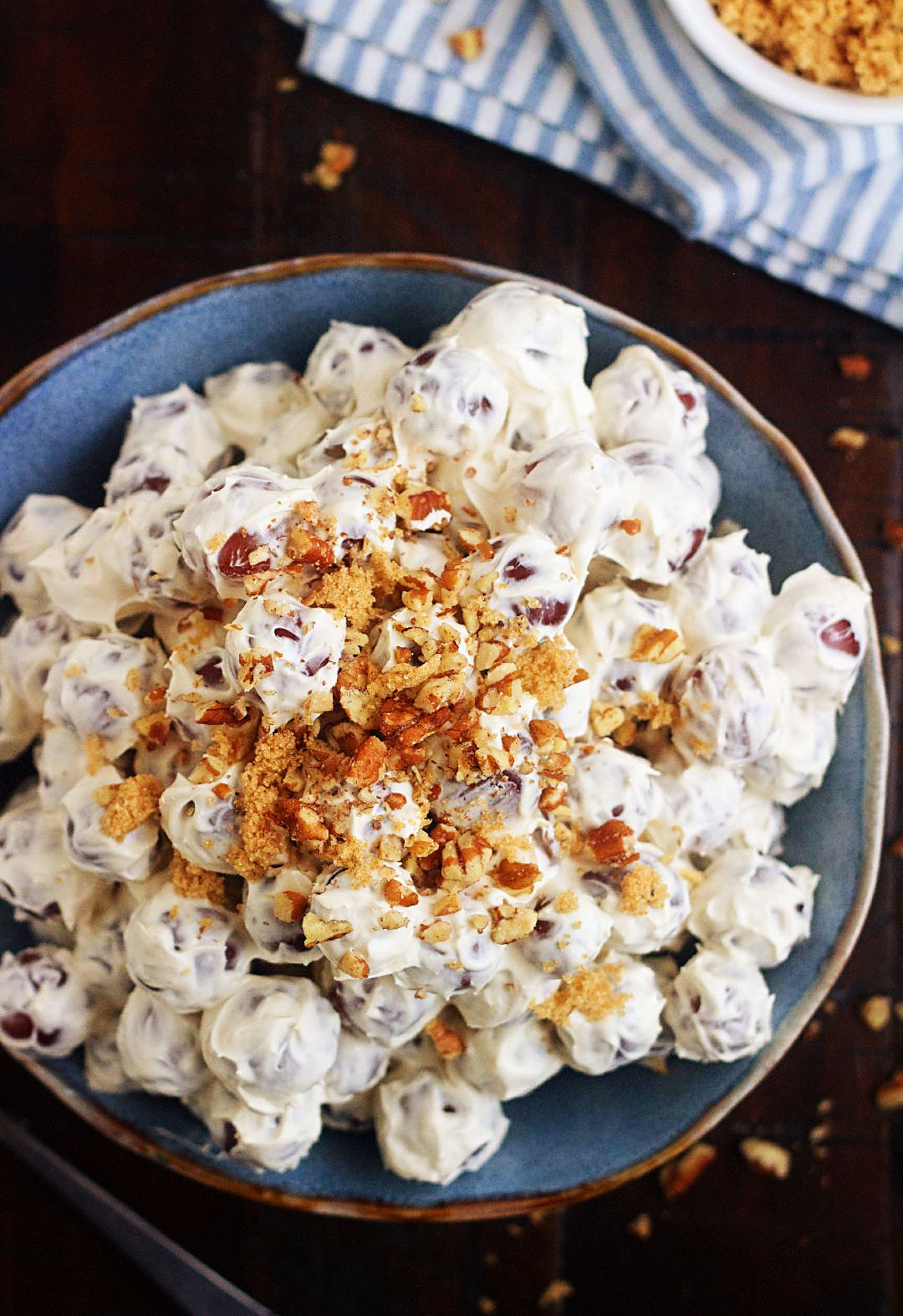 Grape Salad is full of fresh, sweet grapes, tossed in a sweet cream cheese dressing, then sprinkled with brown sugar and pecans. Life-in-the-Lofthouse.com