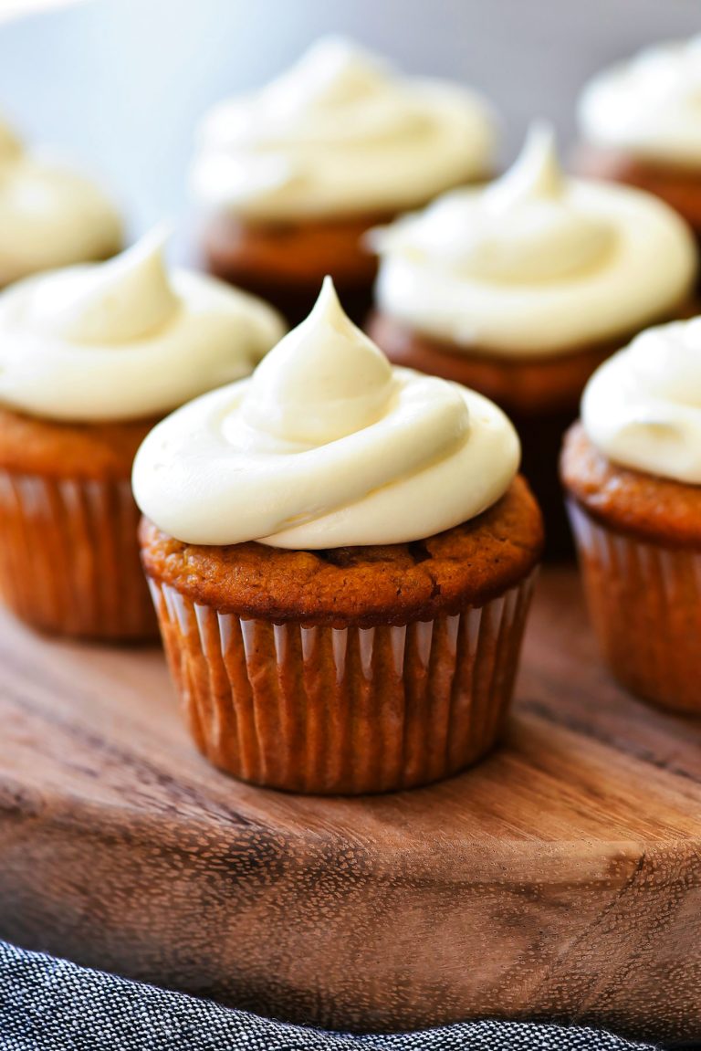 Pumpkin Cheesecake Cupcakes are so delicious with their surprise cheesecake center and wonderful pumpkin-spice flavor throughout!