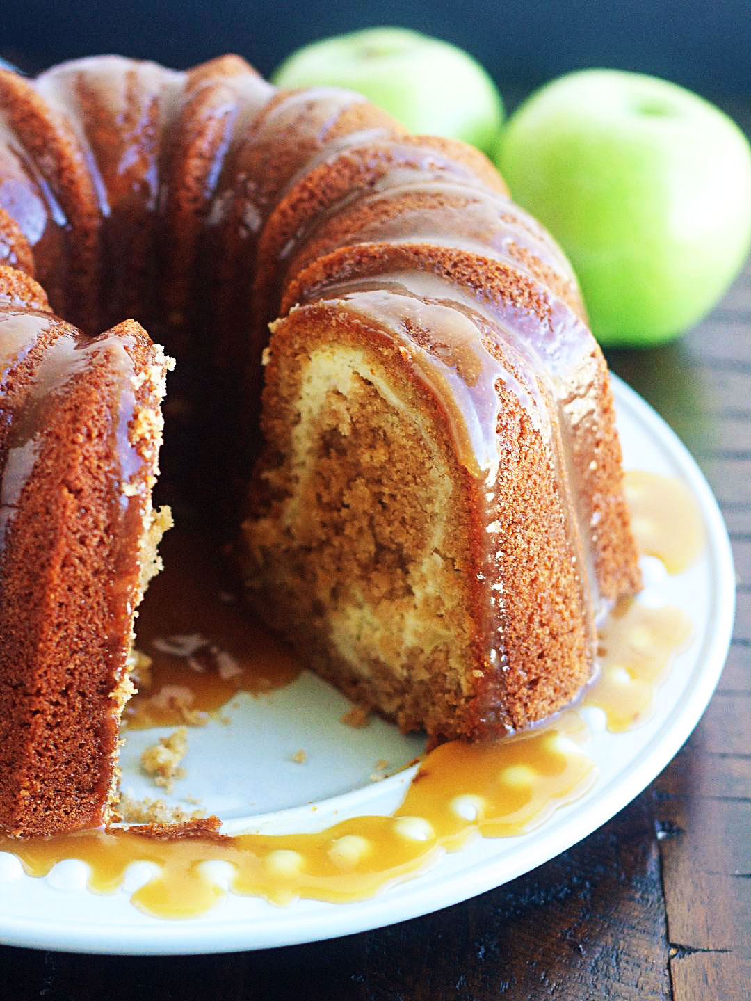 Apple Bundt Cake with Cream Cheese Swirl with limes in the back