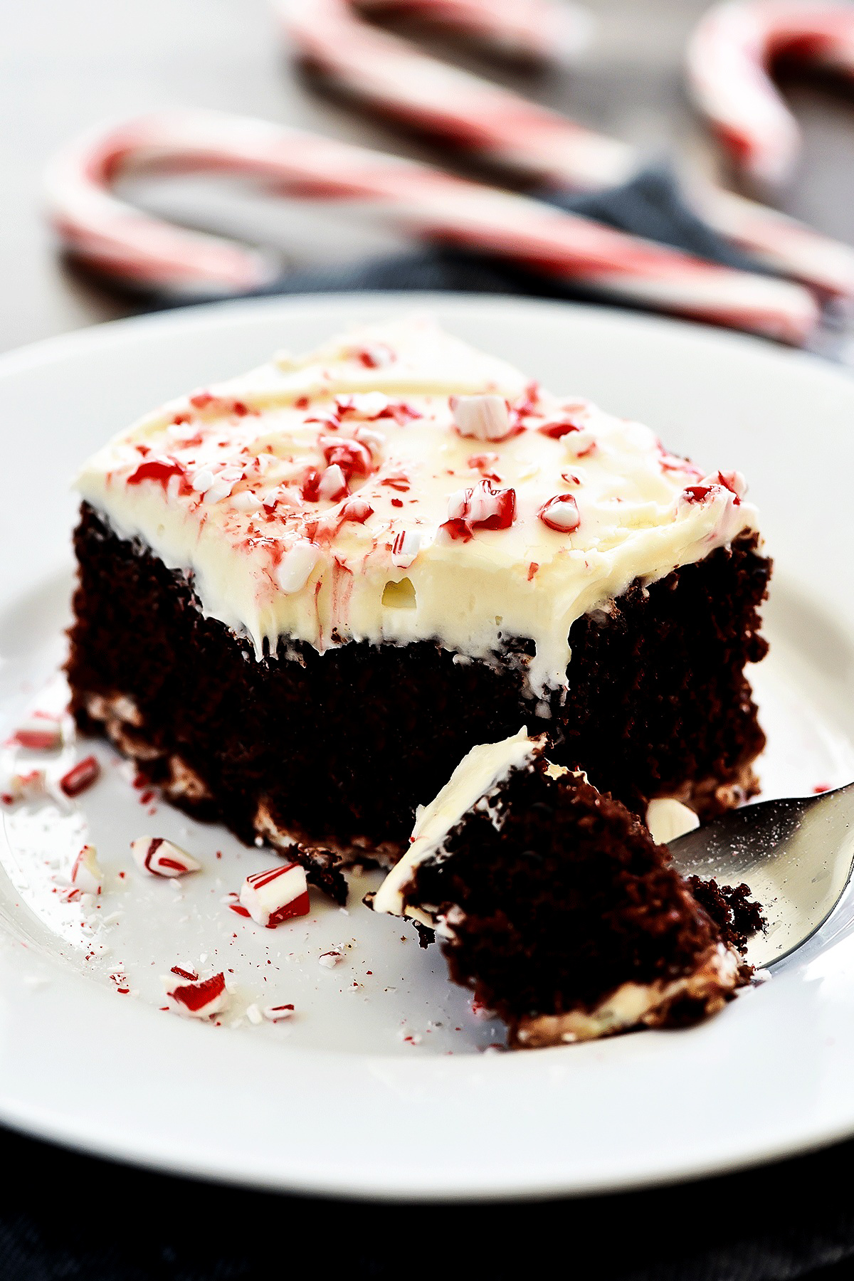 Swirls of cheesecake run through this chocolate cake with cream cheese frosting and crushed candy canes. Life-in-the-Lofthouse.com