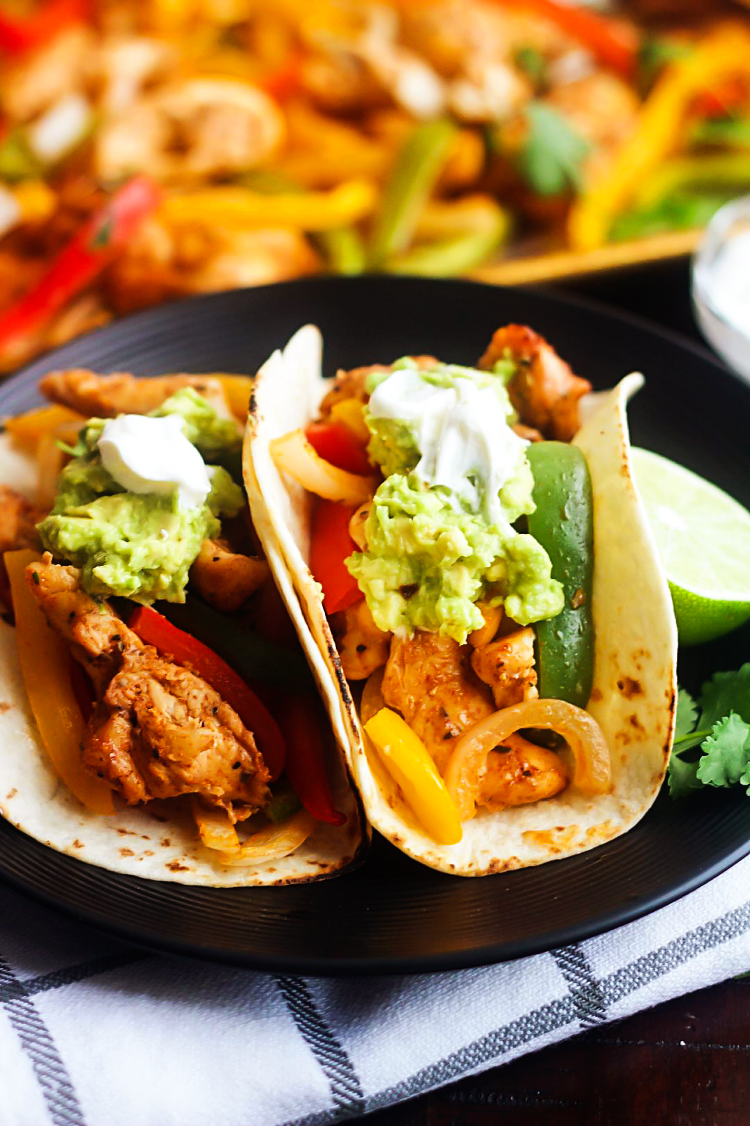 Sheet Pan Chicken Fajitas are pieces of chicken, peppers and onions full of southwest flavor. Life-in-the-Lofthouse.com